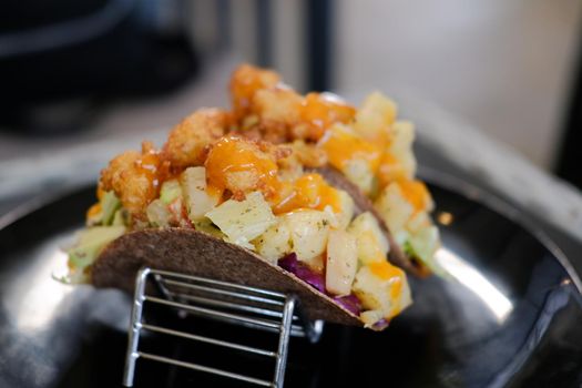 homemade gluten-free vegan tacos with pineapple lettuce cabbage.