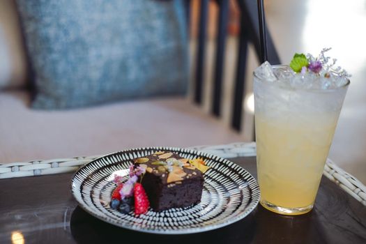 dark chocolate homemade keto vegan flourless brownie with lemon beverage drink