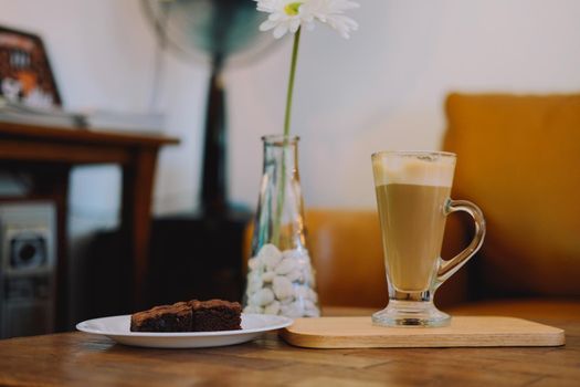 brownie and hot latte cappuccino mocha coffee in living room