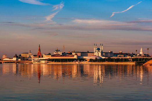 Kazan kremlin in sunset light reflecting on water surface