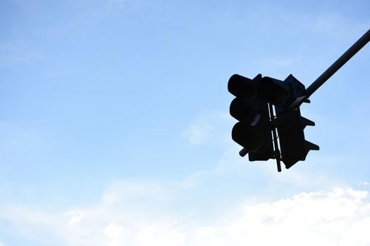 Traffic light with blue sky background.