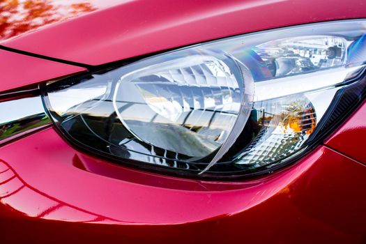 Closeup headlights of red car