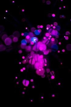 Purple bokeh light celebrate at night, defocus light abstract background.