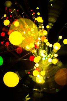 Colorful bokeh light celebrate at night, defocus light abstract yello background.