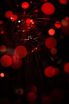 Red bokeh light celebrate at night, defocus light abstract background.