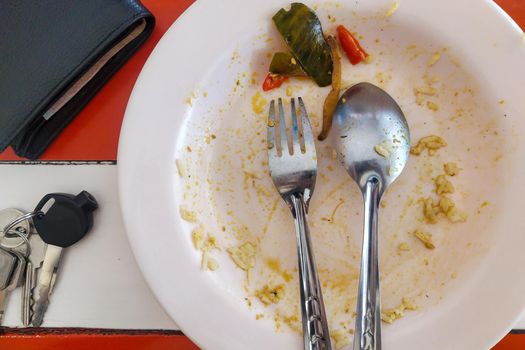 Rice plate after eating out, placed on the table