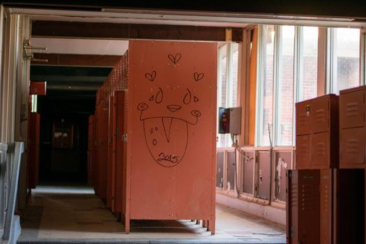 A Locker Room With Red Lockers in an Abandoned School
