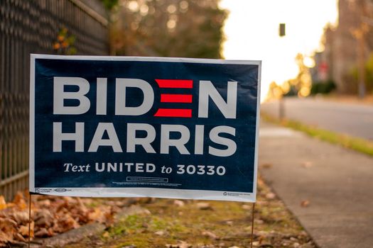 December 5, 2020 - Elkins Park, Pennsylvania: A Biden Harris Campaign Sign on a Suburban Street Next to a Black Metal Fence