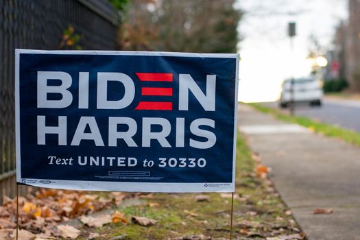 December 5, 2020 - Elkins Park, Pennsylvania: A Biden Harris Campaign Sign on a Suburban Street Next to a Black Metal Fence