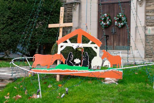 A Wooden Nativity Scene on the Front Lawn of a Church