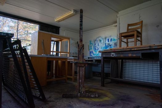 An Old Art Studio in an Abandoned School With an Easel In It