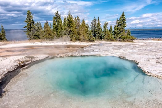 Hot thermal spring Abyss Pool in Yellowstone National Park, West Thumb Geyser Basin area, Wyoming, USA