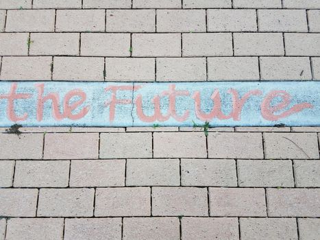 red future sign or text on red bricks or masonry on ground