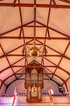 inside church worship house with stained galss windows and pedestal