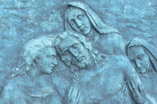 Beautiful light blue low relief depicting Jesus Christ and his death.