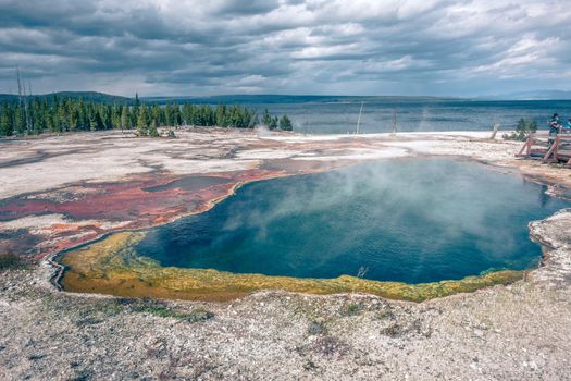 Hot thermal spring Abyss Pool in Yellowstone National Park, West Thumb Geyser Basin area, Wyoming, USA