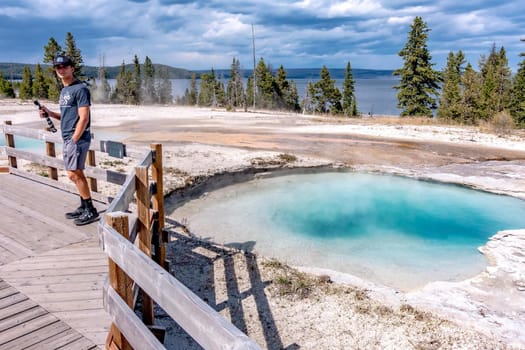 Hot thermal spring Abyss Pool in Yellowstone National Park, West Thumb Geyser Basin area, Wyoming, USA