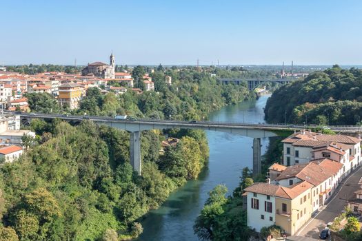 Trezzo sull'Adda (MI) , ITALY - September 5, 2020. Aerial view river trezzo and the bridge. Vegetation and industrialization.