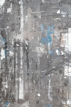 Worn abandoned urban street poster detail. Grunge texture. Ideal for concepts and backgrounds.