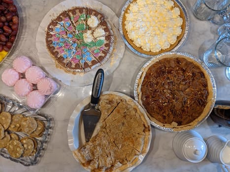 variety of cakes and desserts on table for holidays