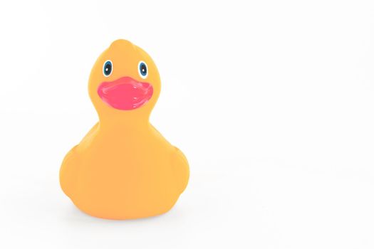 Orange rubber duck isolated over white background with copy space.