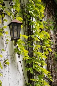 A Closeup shot of a street lamp hanging on a wall
