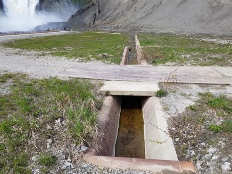 path or trail and bridge with gutter drain and waterfall in Canada