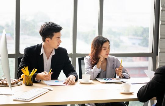 business people working on project at Modern Startup Office. Business People Meeting Discussion Working Concept, business people are meeting to analyze data for marketing plan