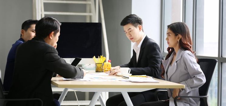 Multiethnic diverse group of business coworkers in team meeting discussion