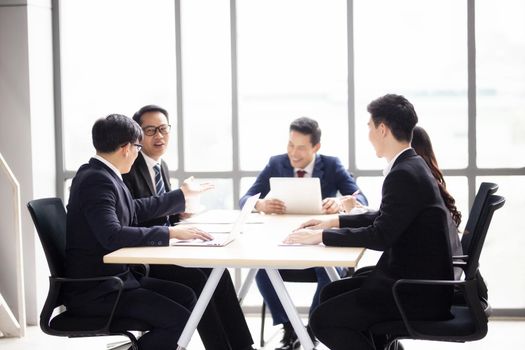 Multiethnic diverse group of business coworkers in team meeting discussion