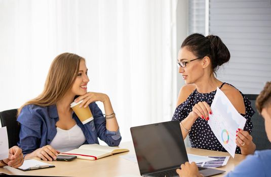 business people working on project at Modern Startup Office. Business People Meeting Discussion Working Concept, business people are meeting to analyze data for marketing plan