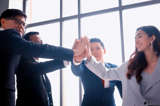 young business people putting their hands together. Stack of hands. Unity, teamwork concept