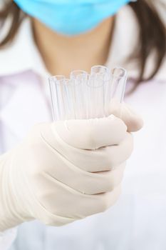 Technician scientist analyzing holding test tube in laboratory for testing it on COVID, COVID-19, coronavirus virus analysis