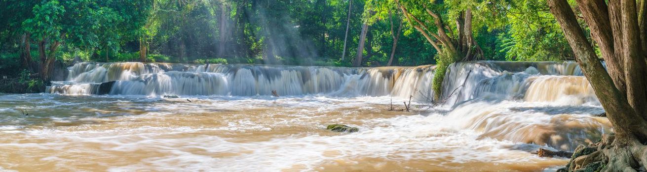 Water falls in tropical rainforest with rock and tree.  Namtok chet saonoi National Park in Thailand