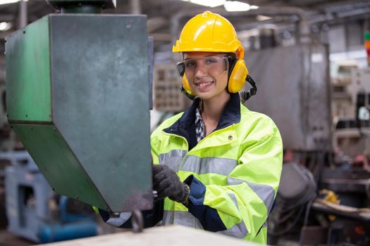 Female Engineers operating a cnc machine in factory