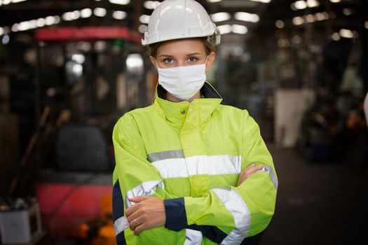 Female with mask Engineers standing in factory