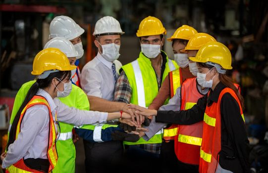 Male Industrial Engineers Talk with Factory Worker . They Work at the Heavy Industry Manufacturing Facility.