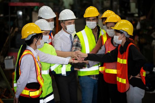 Male Industrial Engineers Talk with Factory Worker . They Work at the Heavy Industry Manufacturing Facility.