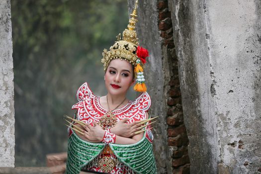 Beautiful Thai young woman portrait in Kinnaree traditional dress costume Art culture Thailand Dancing in masked khon Kinnaree in literature amayana, thailand culture Khon, Ayuttaya, Thailand .