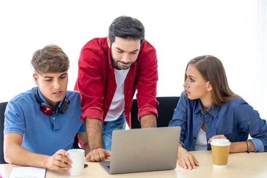 Business people working in office on desktop computer, Group of happy business people in smart casual wear looking at the laptop and gesturing. Achieving success.