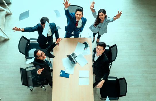 Top view on a group of businessman and businesswoman having a meeting and making a business commitment.