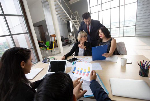 Multiethnic diverse group of business coworkers in team meeting discussion