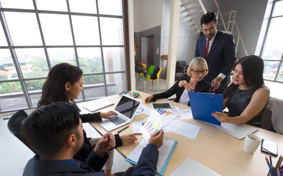 Multiethnic diverse group of business coworkers in team meeting discussion