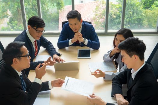 Multiethnic diverse group of business coworkers in team meeting discussion