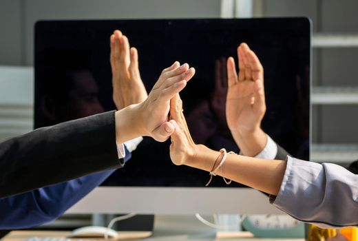 young business people putting their hands together. Stack of hands. Unity, teamwork concept