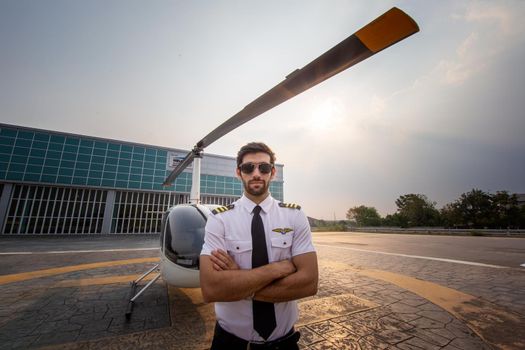 Shot of a mature Helicopter pilot using a headset while traveling in a helicopter, Business people traveling by helicopter