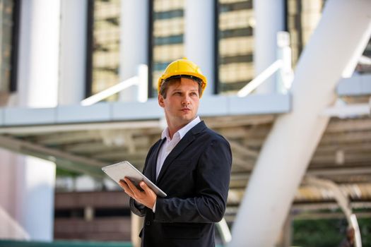 Construction engineers discussion with architects at construction site or building site