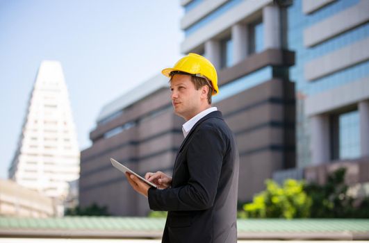 Construction engineers discussion with architects at construction site or building site