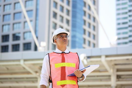 Construction engineers discussion with architects at construction site or building site