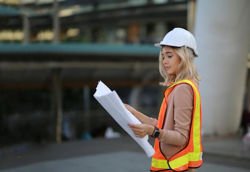 Construction engineers discussion with architects at construction site or building site